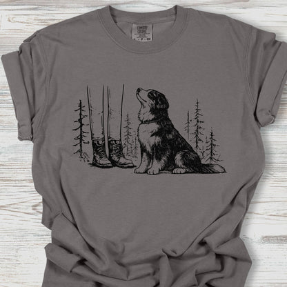 Gray t-shirt with a dog and nature graphic on a wooden surface