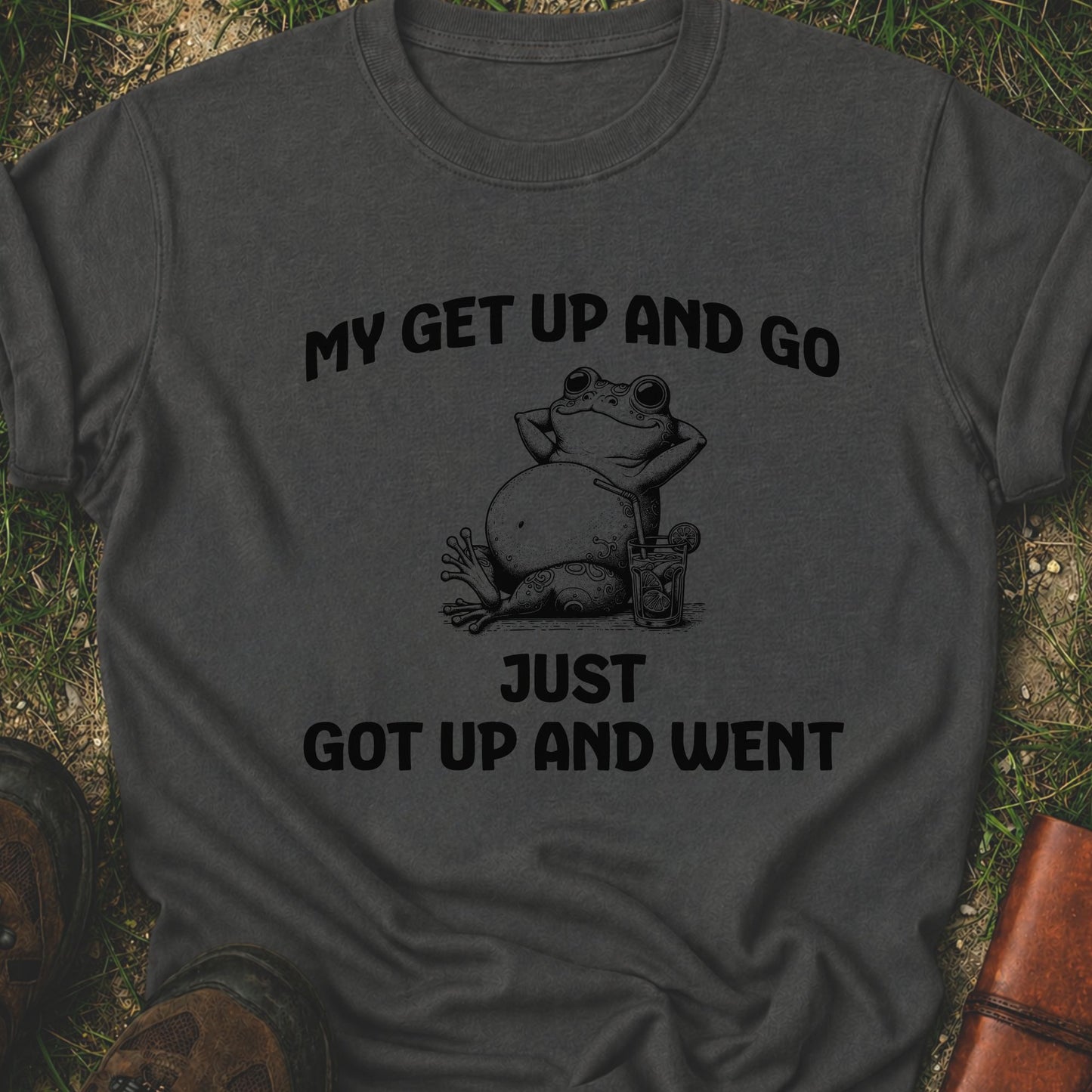 Dark gray t-shirt with a frog graphic and text on grass