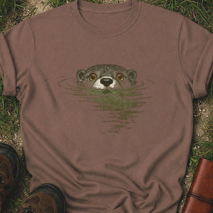 Brown t-shirt with otter design on grass
