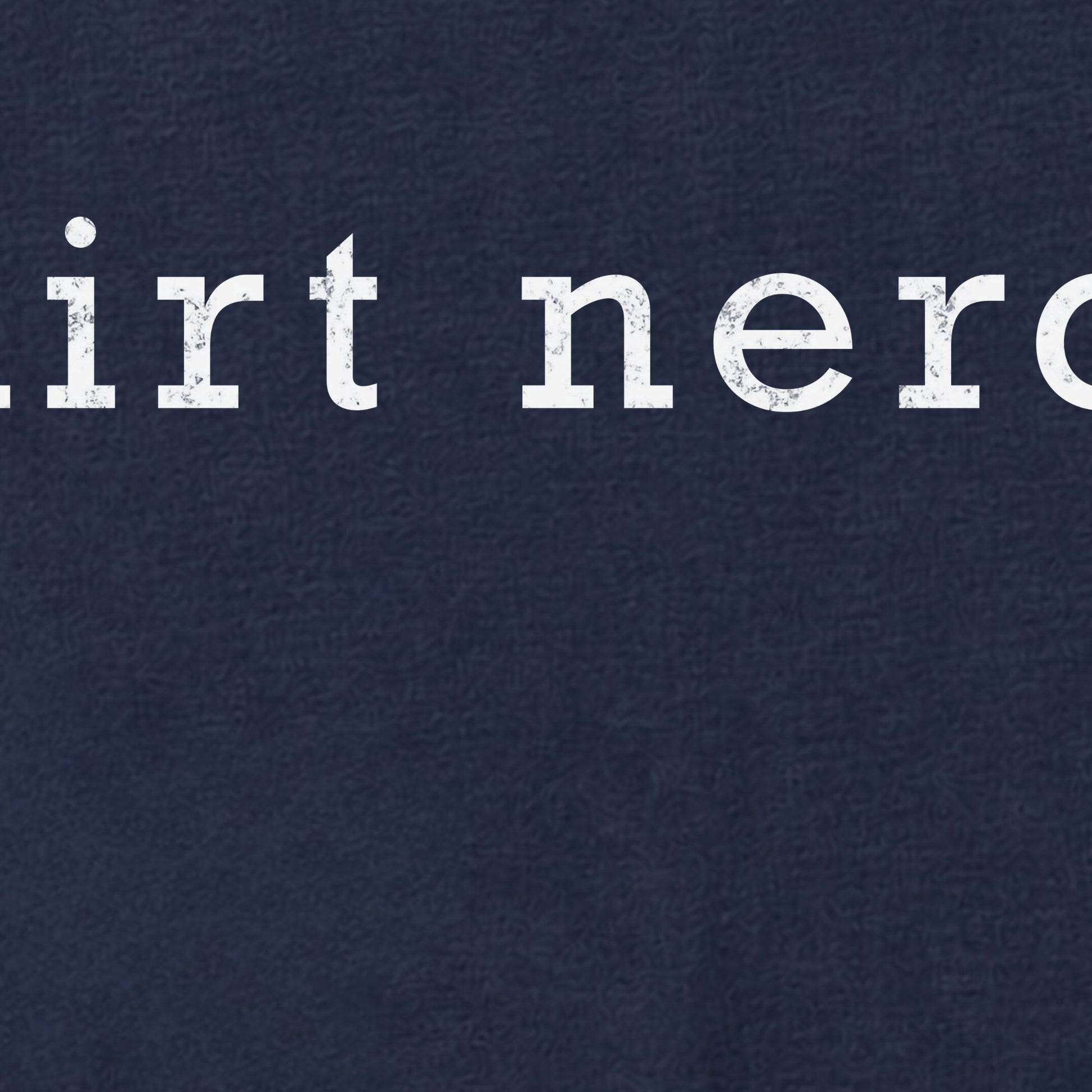 Navy blue shirt zoomed into text showing the distressed texture on the lettettering