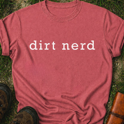 Dark Pink t-shirt with 'dirt nerd' text on grass