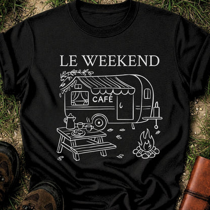Black t-shirt with 'Le Weekend Café' design featuring a caravan and outdoor setup on grass.