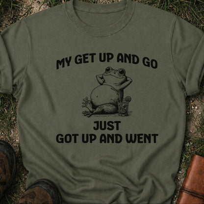 Green t-shirt with a frog graphic and text on grass